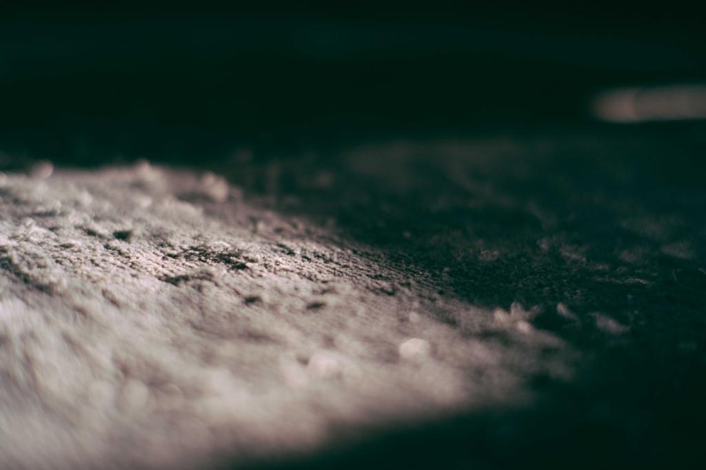 A close-up shot of a dirty carpet